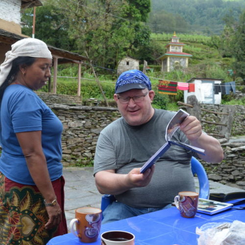 Tourist with showing photo in the Majhgaon village
