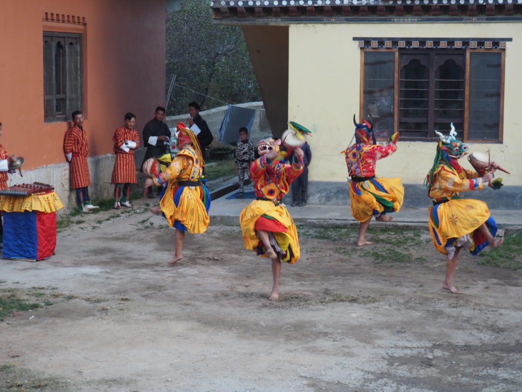 Traditional mask dance performance in Bhutan during Nepal Bhutan tour with Evergreen Tours